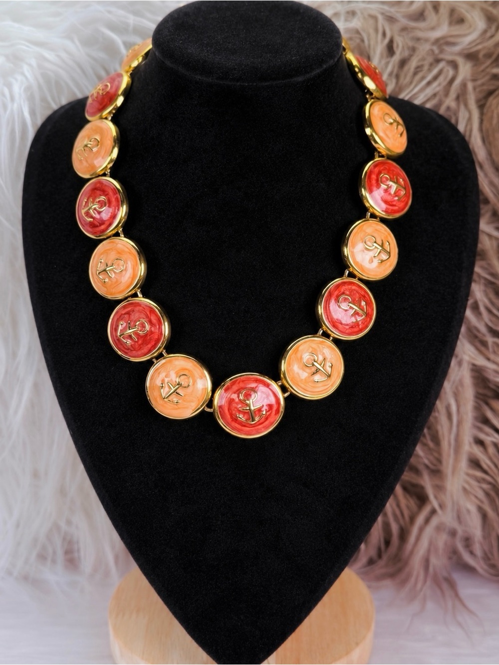 Beautiful weighted, goldtone colored enamel swirl, nautical anchor necklace